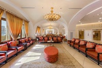 a large lobby with couches and a chandelier